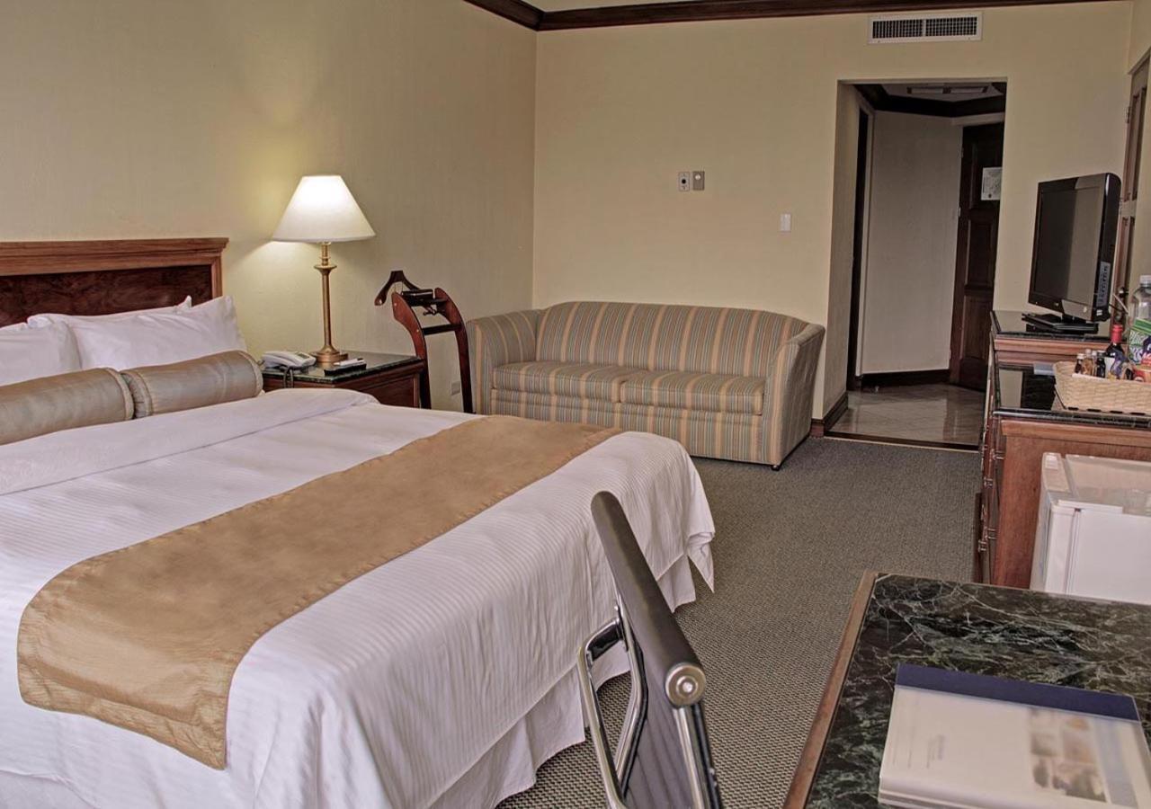 Wyndham San Jose Herradura Exterior photo A room at the hotel